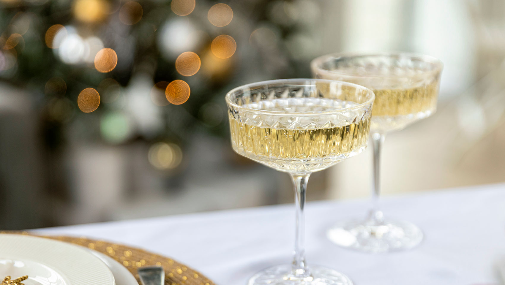 2 glasses of champagne at a holiday party