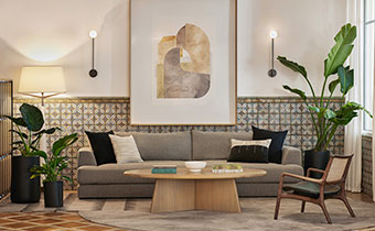 tan couch in canary lobby with coffee table, plants and chair